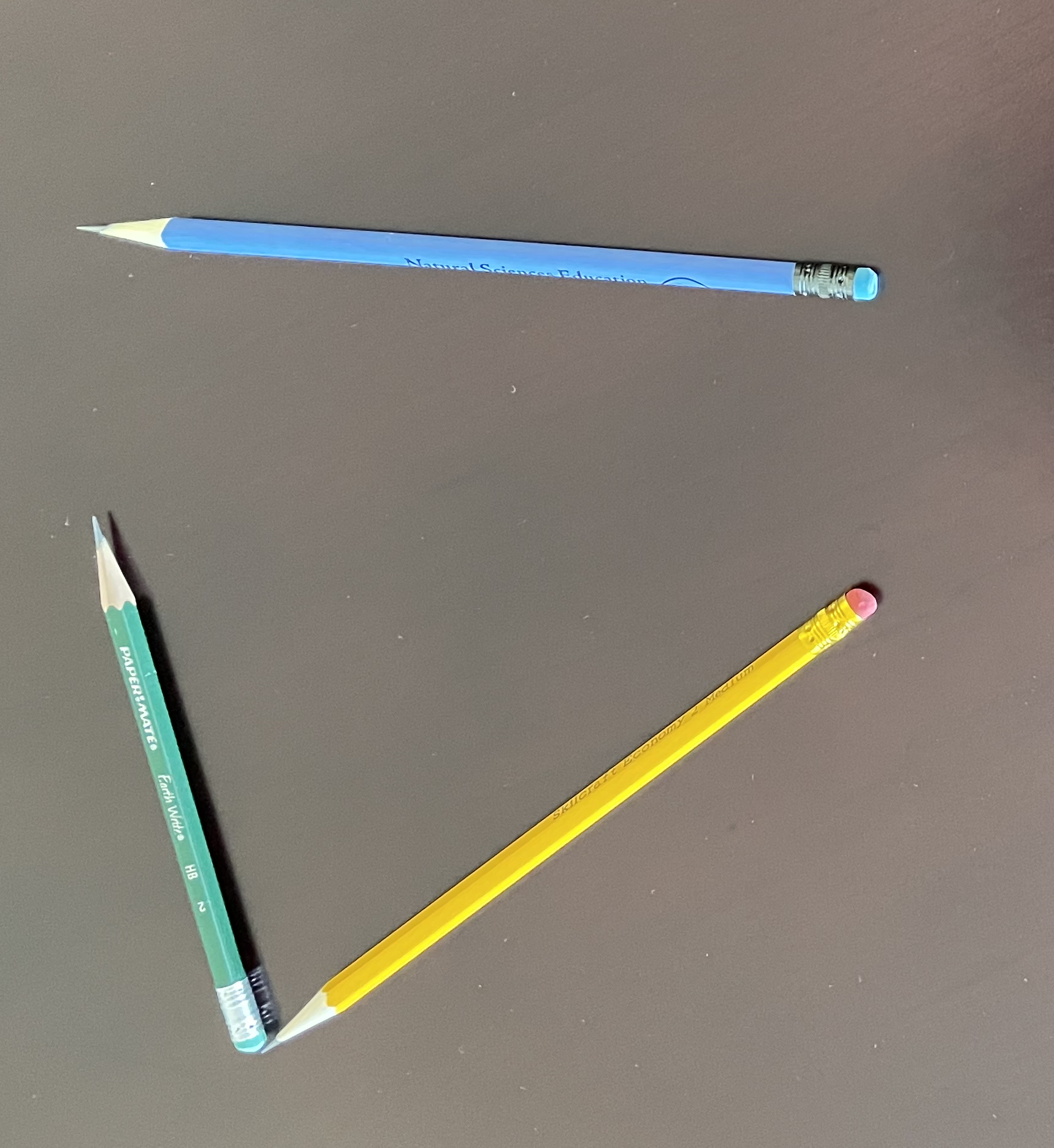 Adding two vectors, yellow and green, by placing them tail to tip. The result is the vector going from the tail of yellow to the tip of green. This resultant is equivalent to the blue vector.
